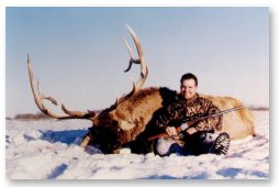 Adam took this 361 4/8" SCI bull elk late in the season.